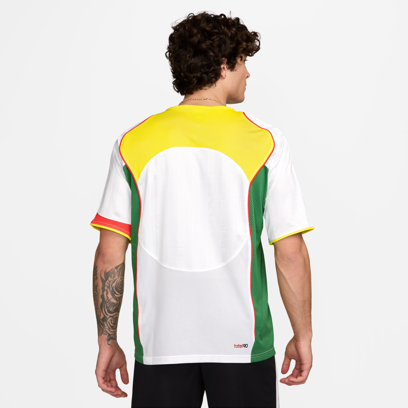 green red and yellow nike shirt